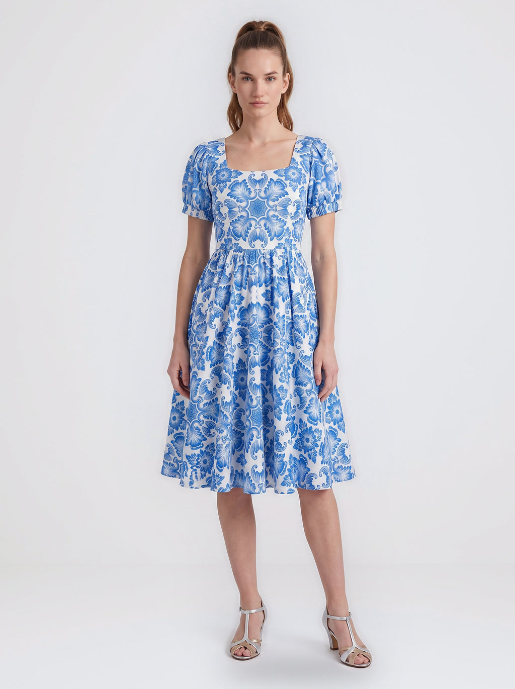 Amara swing dress in blue and white Noto Tile print with puff sleeves and a full swing skirt, by Pinup Girl Clothing