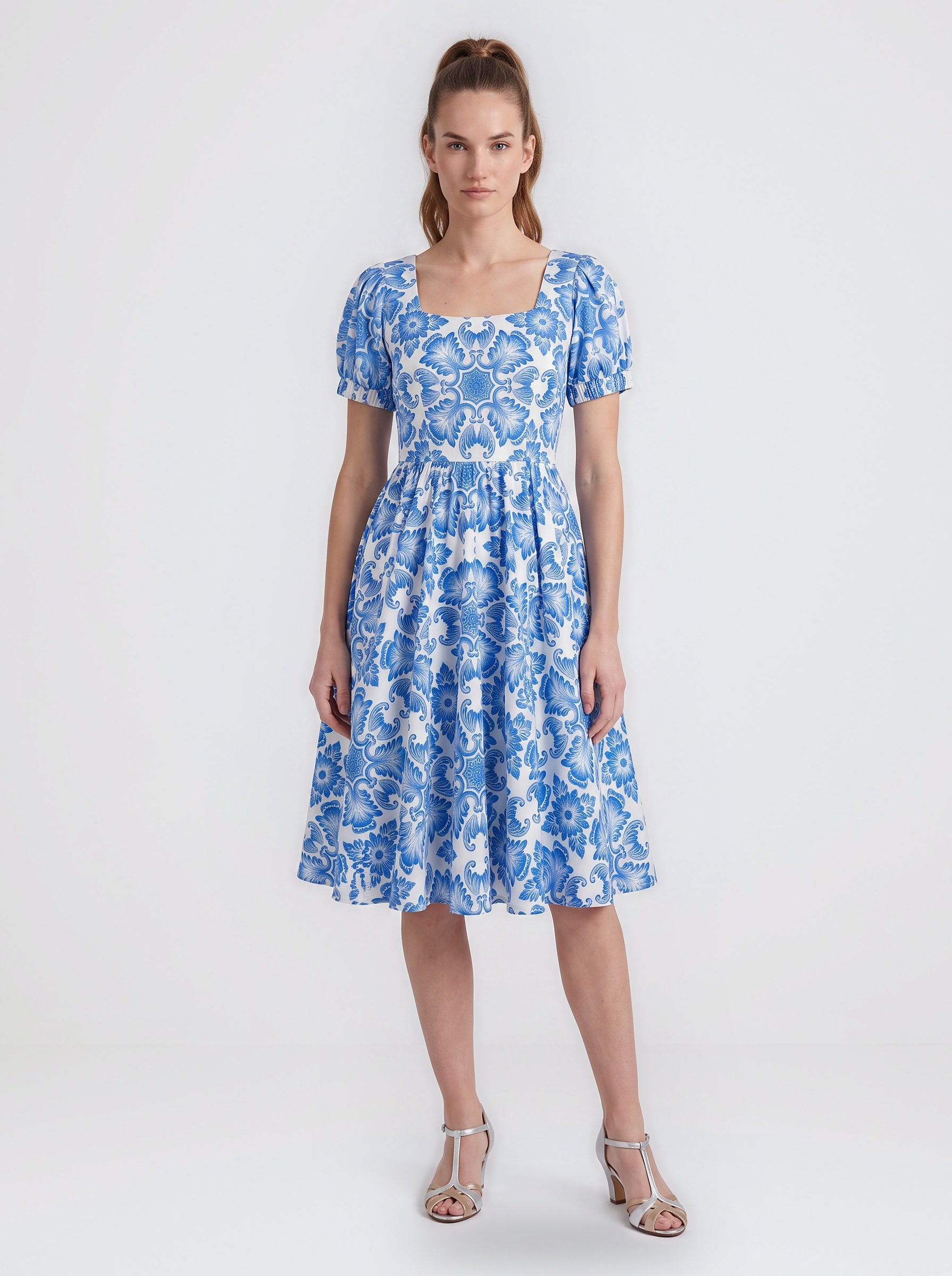 Amara swing dress in blue and white Noto Tile print with puff sleeves and a full swing skirt, by Pinup Girl Clothing