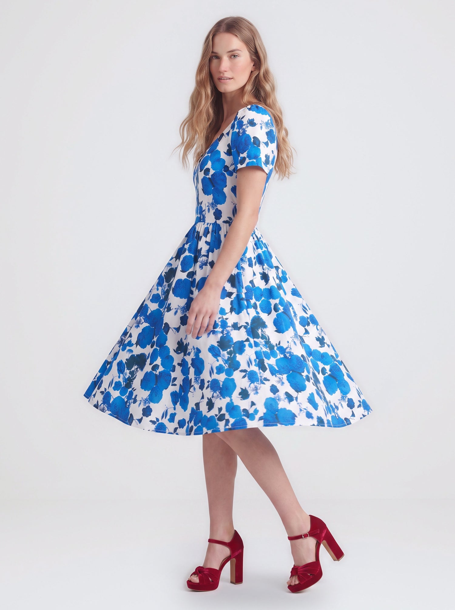 Lilith swing dress in Blue Fiori Dolce, a blue and white painted floral cotton sateen dress with a v neckline and full skirt, by Pinup Girl Clothing
