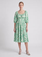 Marie-Therese peasant day dress in green and white Noto Tile print with a full skirt and deep pockets, by Pinup Girl Clothing