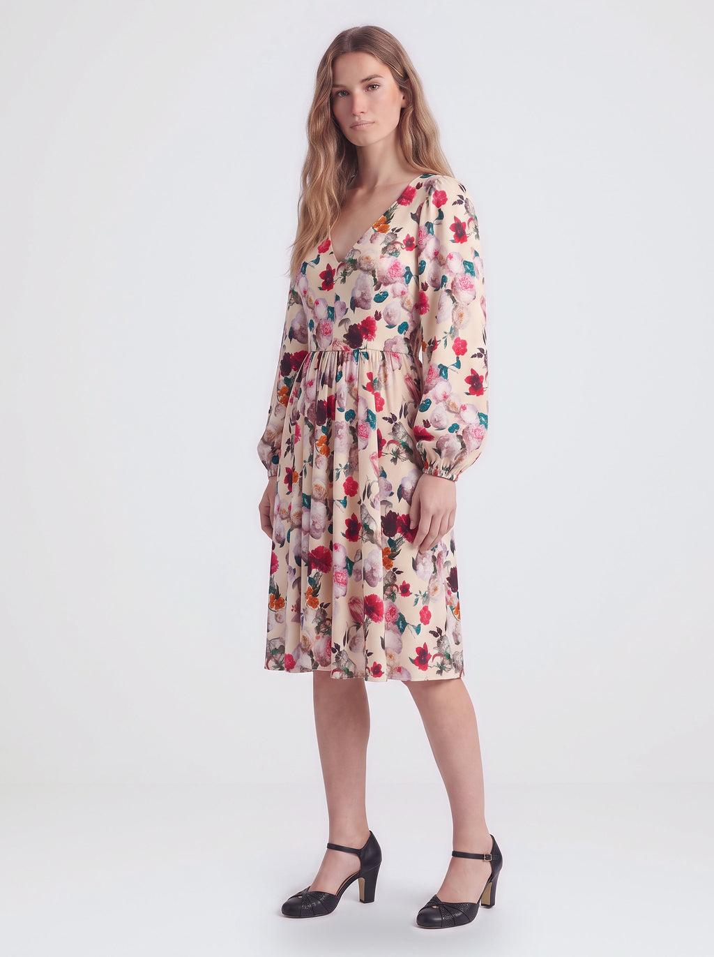 Kara swing dress in Ambrosia Floral ivory, cream and white, with a plunging V neckline and bell sleeves, by Pinup Girl Clothing