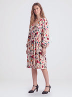 Kara swing dress in Ambrosia Floral ivory, cream and white, with a plunging V neckline and bell sleeves, by Pinup Girl Clothing