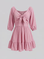 Ghost mannequin view of the Molly Mini dress in Pinup Girl Pink, showing the tie-front bodice and tiered ruffle hem.