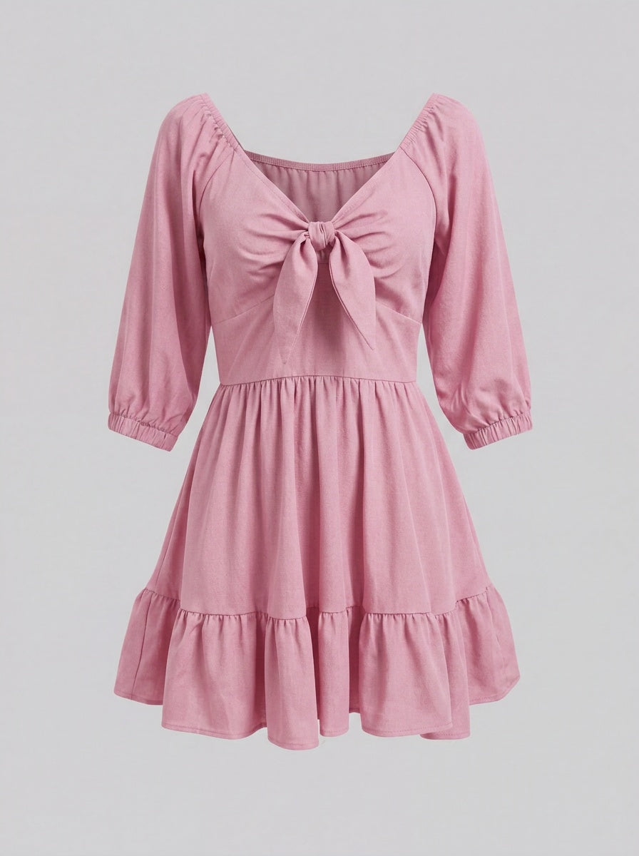Ghost mannequin view of the Molly Mini dress in Pinup Girl Pink, showing the tie-front bodice and tiered ruffle hem.