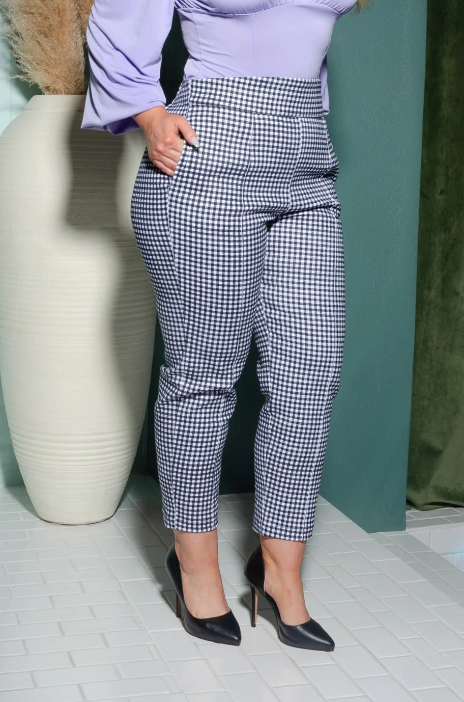 Waist-down view of the LB cropped trousers in black and white gingham with black pointed heels