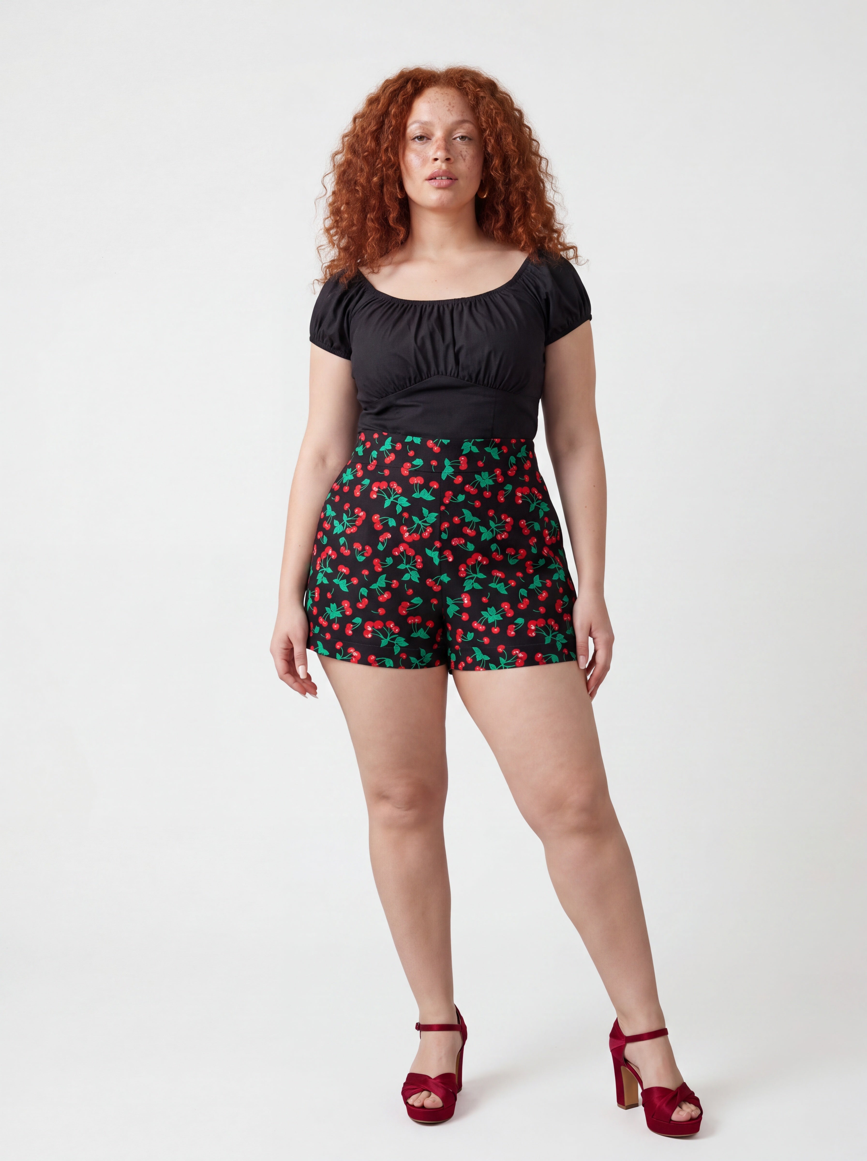 The LB High-Waisted Shorts in vintage cherries black, a Laura Byrnes design by Pinup Girl Clothing.