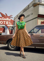 Leaves Bow Top in a green leaf print with an oversized neck bow