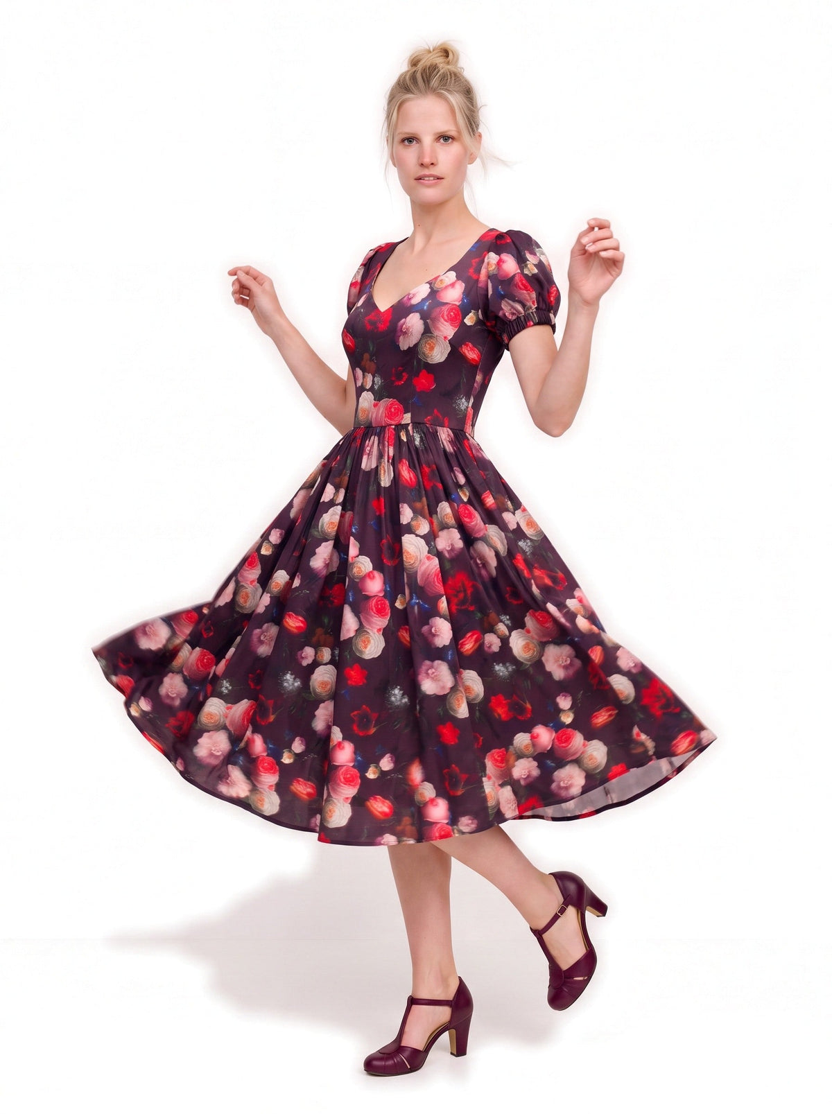 Lucrezia Day Dress in Burgundy Ambrosia Floral in motion, the gathered circle skirt swinging out over burgundy t-strap heels