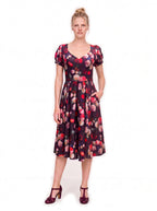Burgundy Ambrosia Floral Lucrezia Day Dress with a hand in the deep in-seam pocket of the gathered circle skirt