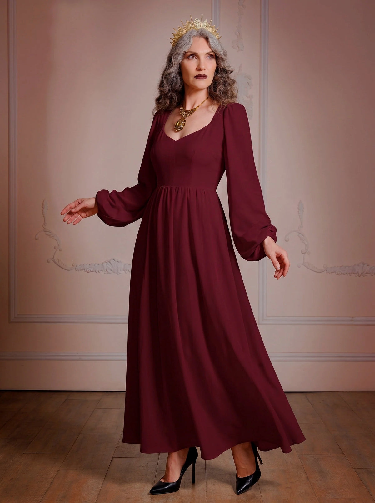 Model in the Lucrezia burgundy renaissance maxi gown, a deep wine-red floor-length dress with a sweetheart neckline, long bishop sleeves and a full gathered skirt with pockets