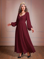 Model in the Lucrezia burgundy renaissance maxi gown, a deep wine-red floor-length dress with a sweetheart neckline, long bishop sleeves and a full gathered skirt with pockets