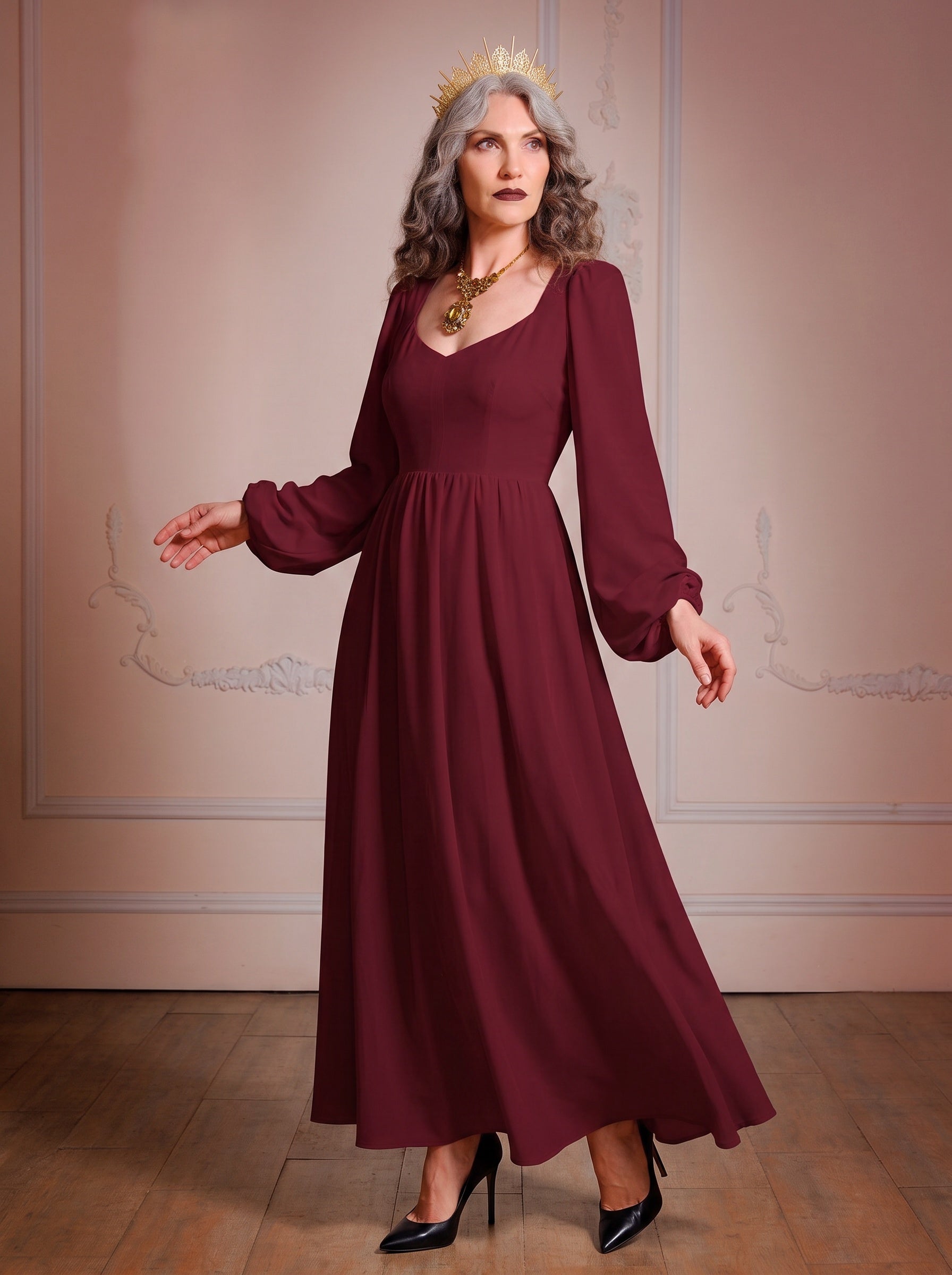 Model in the Lucrezia burgundy renaissance maxi gown, a deep wine-red floor-length dress with a sweetheart neckline, long bishop sleeves and a full gathered skirt with pockets