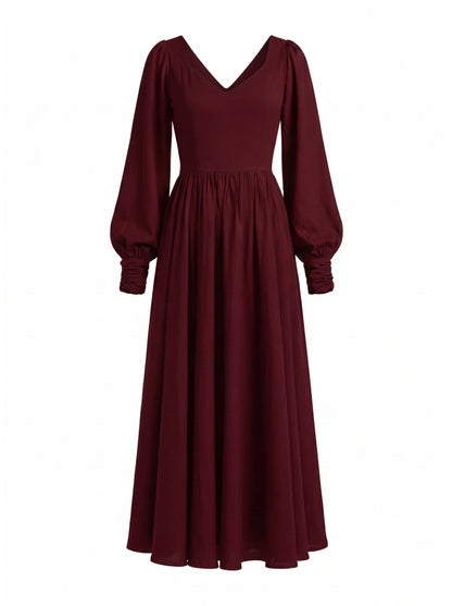 Lucrezia renaissance maxi gown in burgundy shown on its own, front view of the deep wine-red bodice, sweetheart neckline, gathered bishop sleeve cuffs and full circle skirt