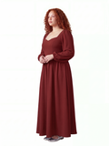 Model in the merlot Lucrezia renaissance maxi gown, three-quarter view, showing the fitted bodice, cuffed bishop sleeves and the full floor-length skirt