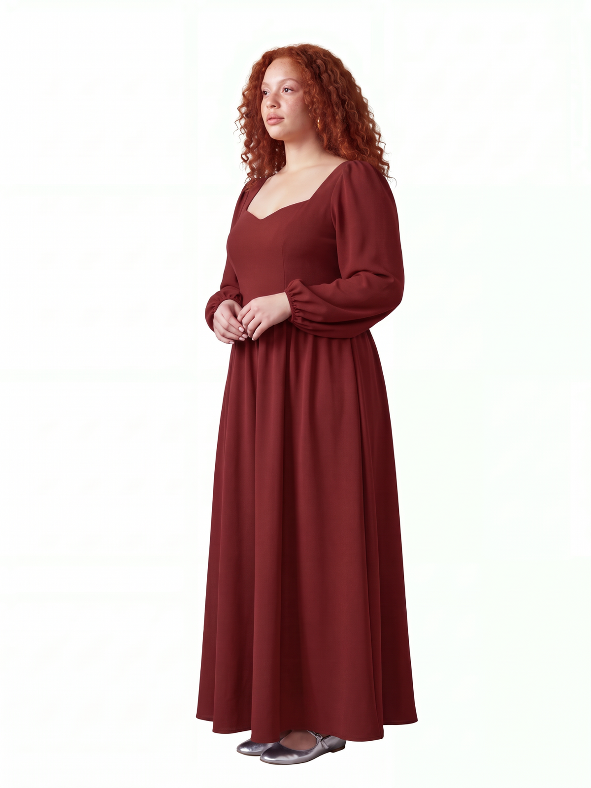 Model in the merlot Lucrezia renaissance maxi gown, three-quarter view, showing the fitted bodice, cuffed bishop sleeves and the full floor-length skirt