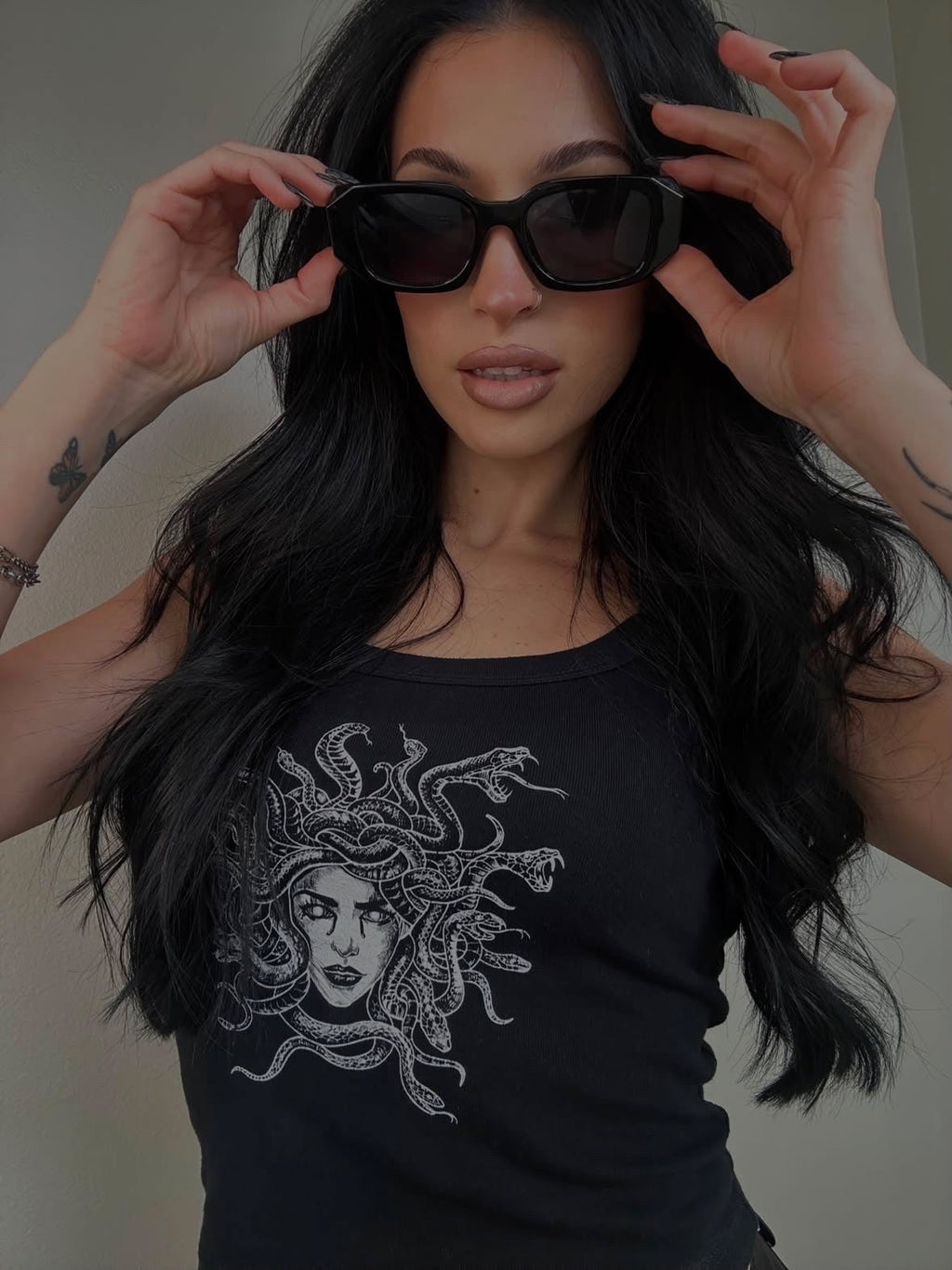 Medusa Graphic Tank, a fitted black tank with a Medusa print