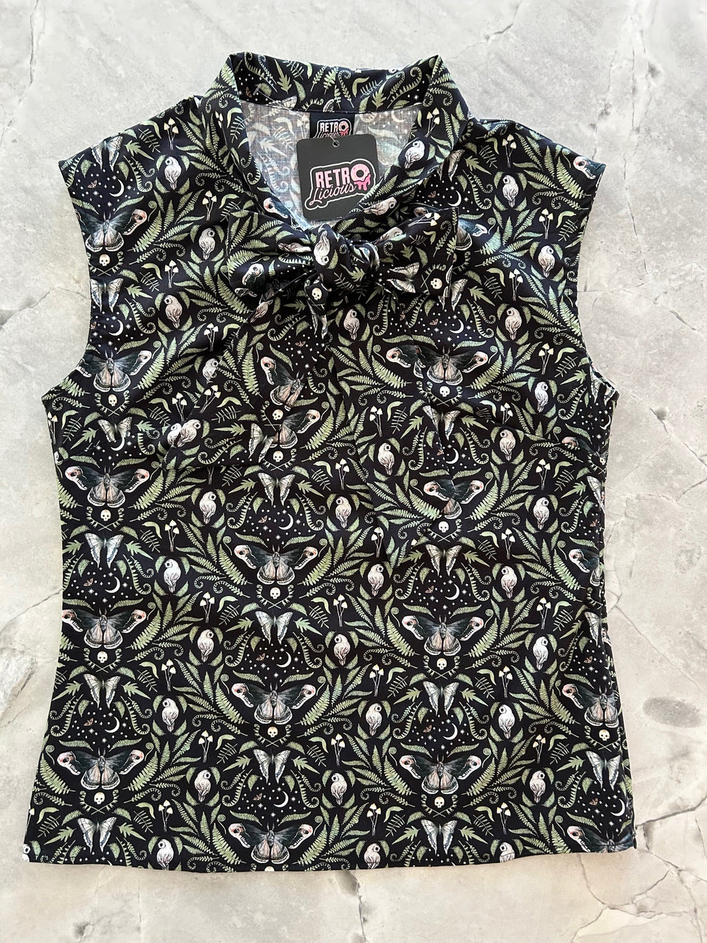 Midnight Bow Top in a black and cream botanical print with an oversized neck bow