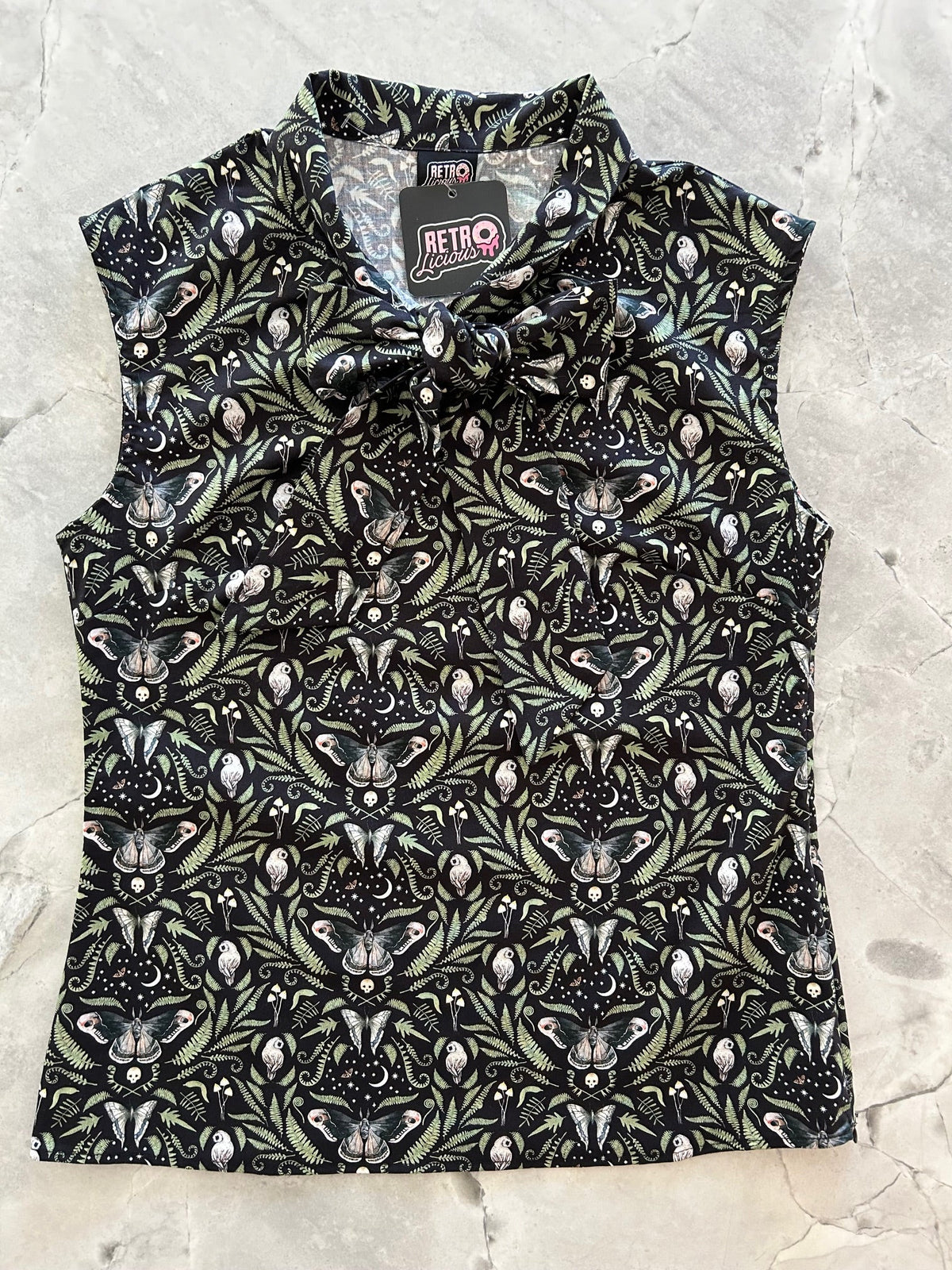 Midnight Bow Top in a black and cream botanical print with an oversized neck bow