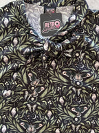 Midnight Bow Top in a black and cream botanical print with an oversized neck bow