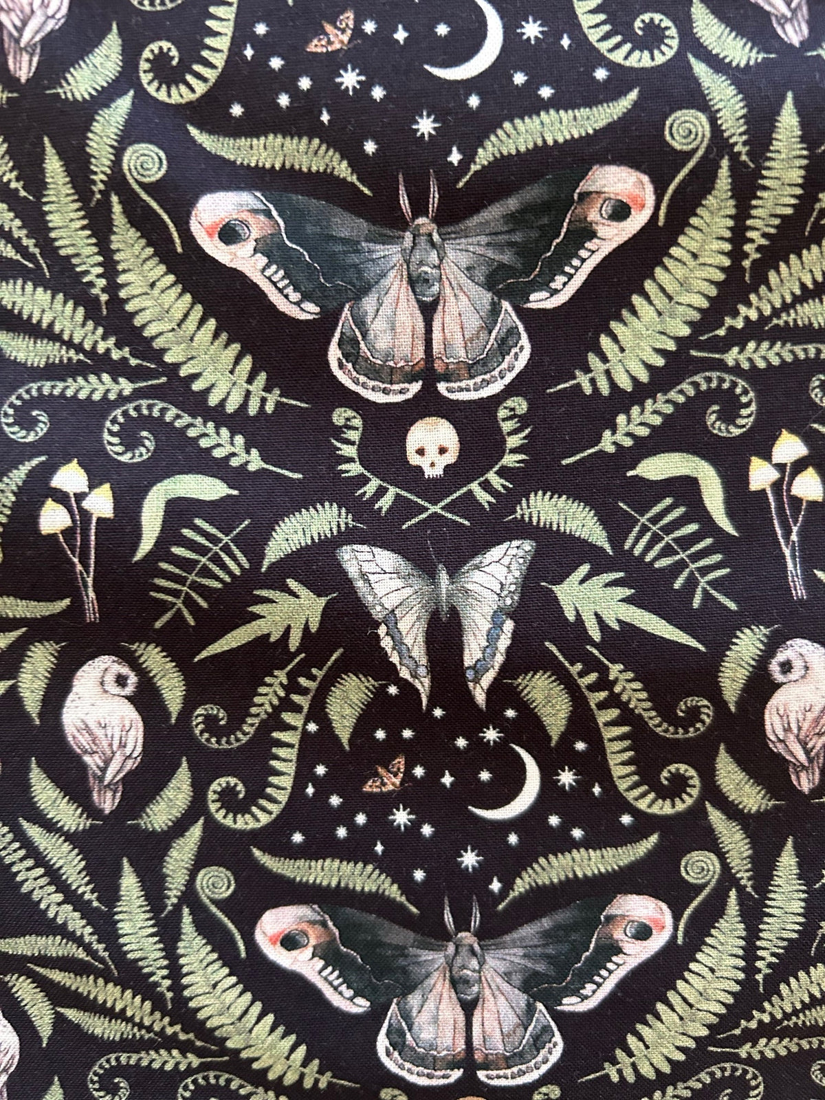 Midnight Bow Top in a black and cream botanical print with an oversized neck bow