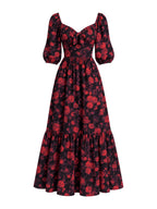 Molly 70s Maxi Gown in Black and Red Ambrosia Floral, ghost mannequin front view showing red roses on black, puff sleeves and a tiered skirt