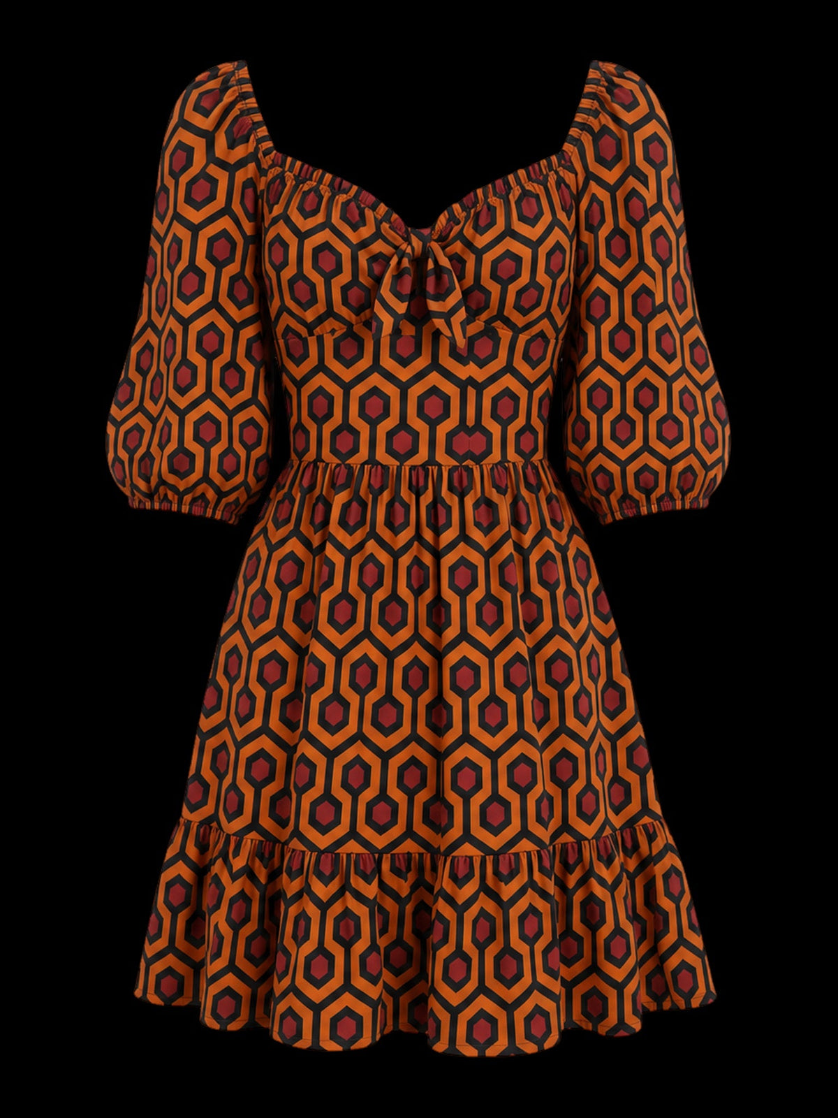 Molly mini dress in the orange and black Hotel Hexagon print, front view on black, showing the gathered sweetheart bodice with a centre knot, blouson sleeves and tiered skirt