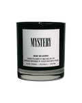Mystery scented soy candle in a black glass jar