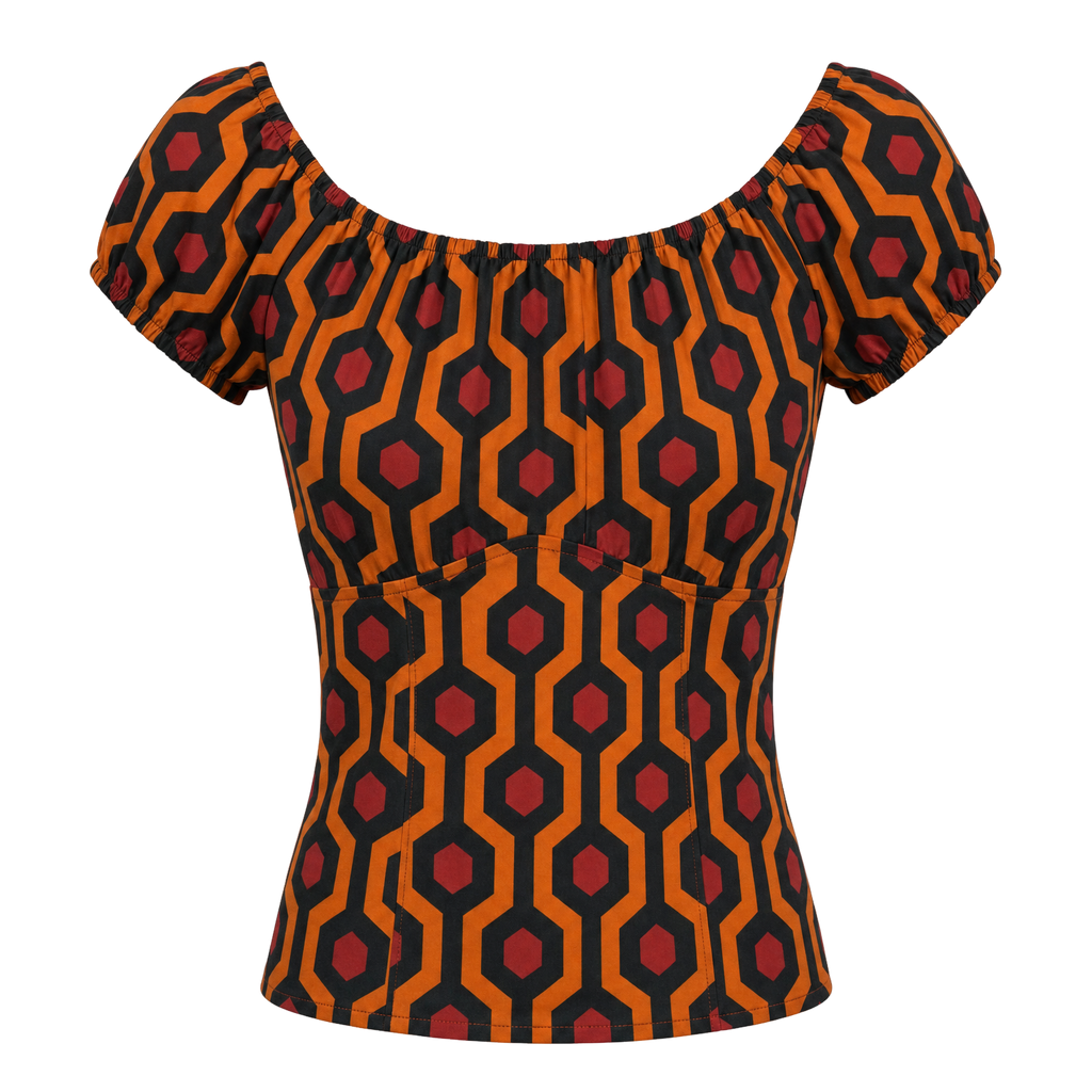The gathered vintage peasant top in the orange and black Hotel Hexagon print on an invisible mannequin, showing the elasticized neckline and short puff sleeves