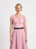 Front view of the vintage peasant top in Pinup Girl Pink worn with the Viva 40s tulip skirt in the same pink and a black belt