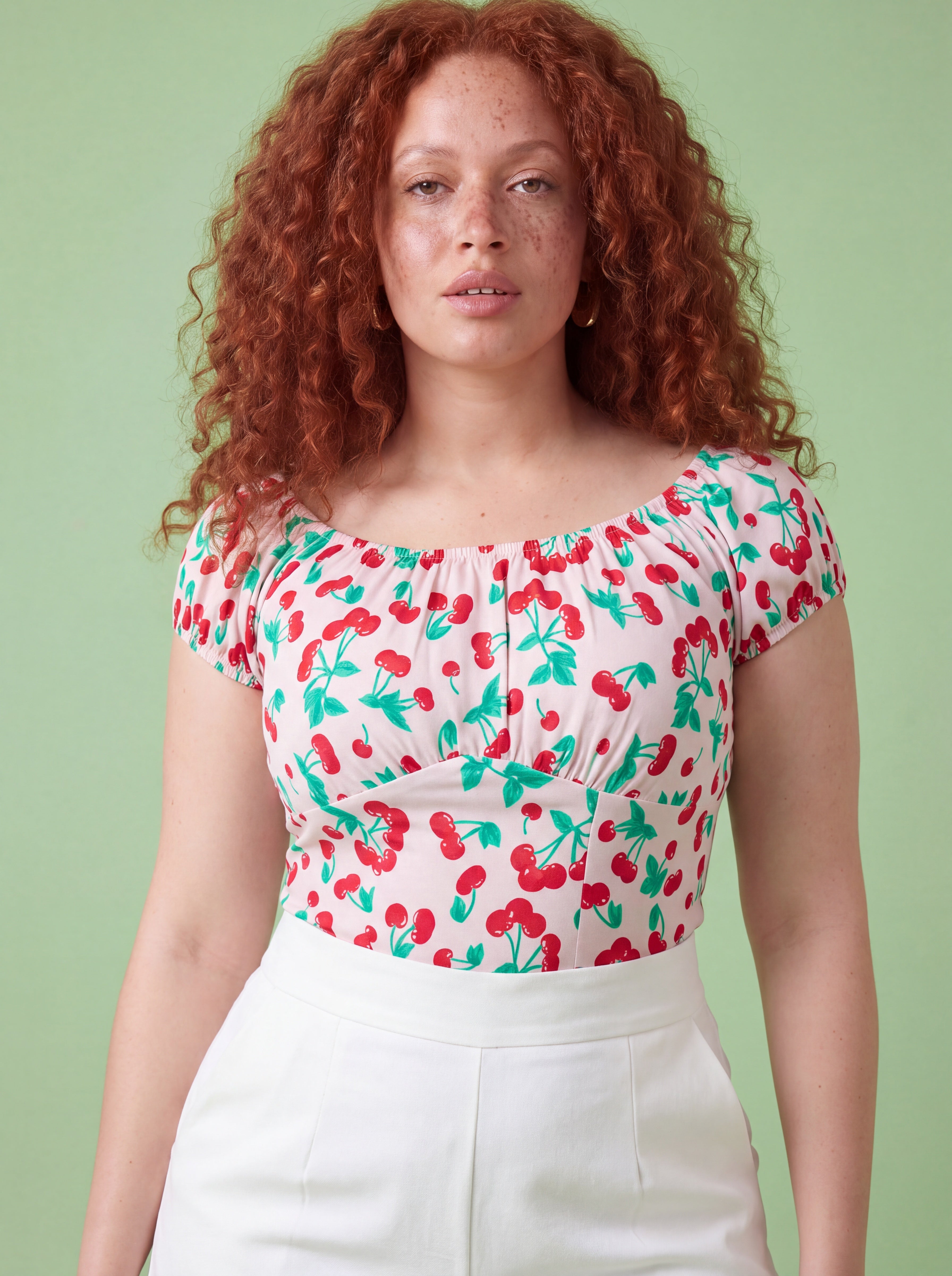 The Perfect Vintage Peasant Top in cherries ivory by Pinup Girl Clothing, sizes XS to 5X.