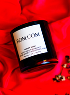 Rom Com candle on red satin
