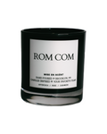 Rom Com scented soy candle in a black glass jar
