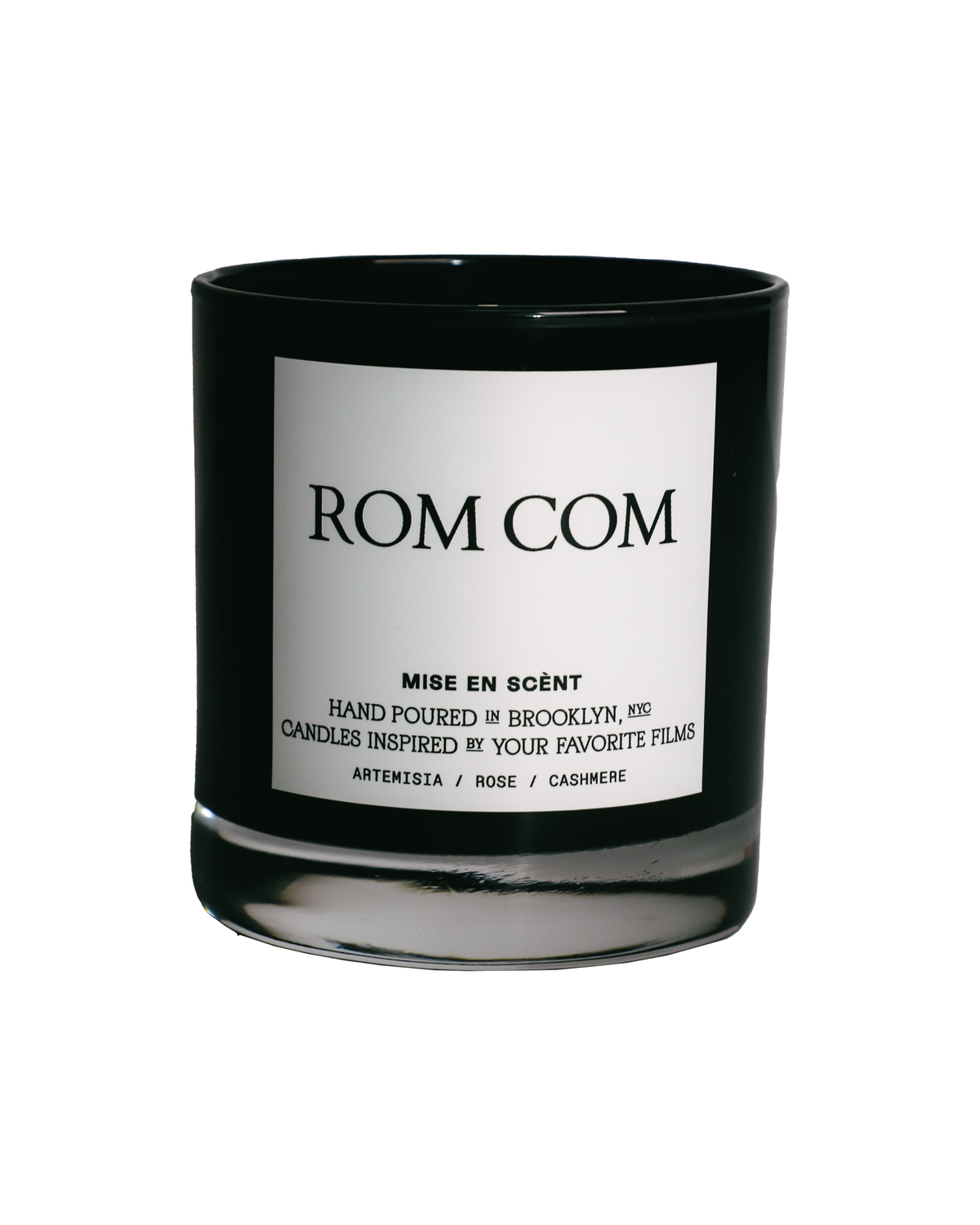 Rom Com scented soy candle in a black glass jar