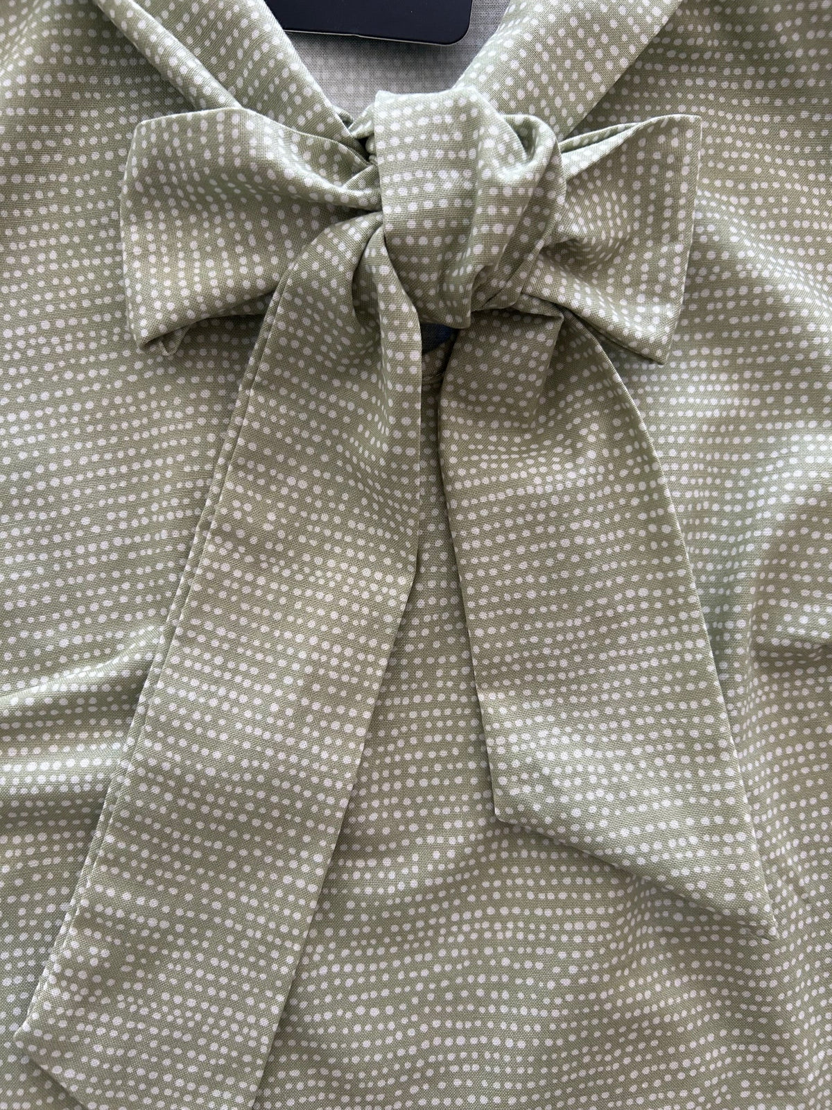 Sage Dot Bow Top in sage green cotton with an oversized neck bow