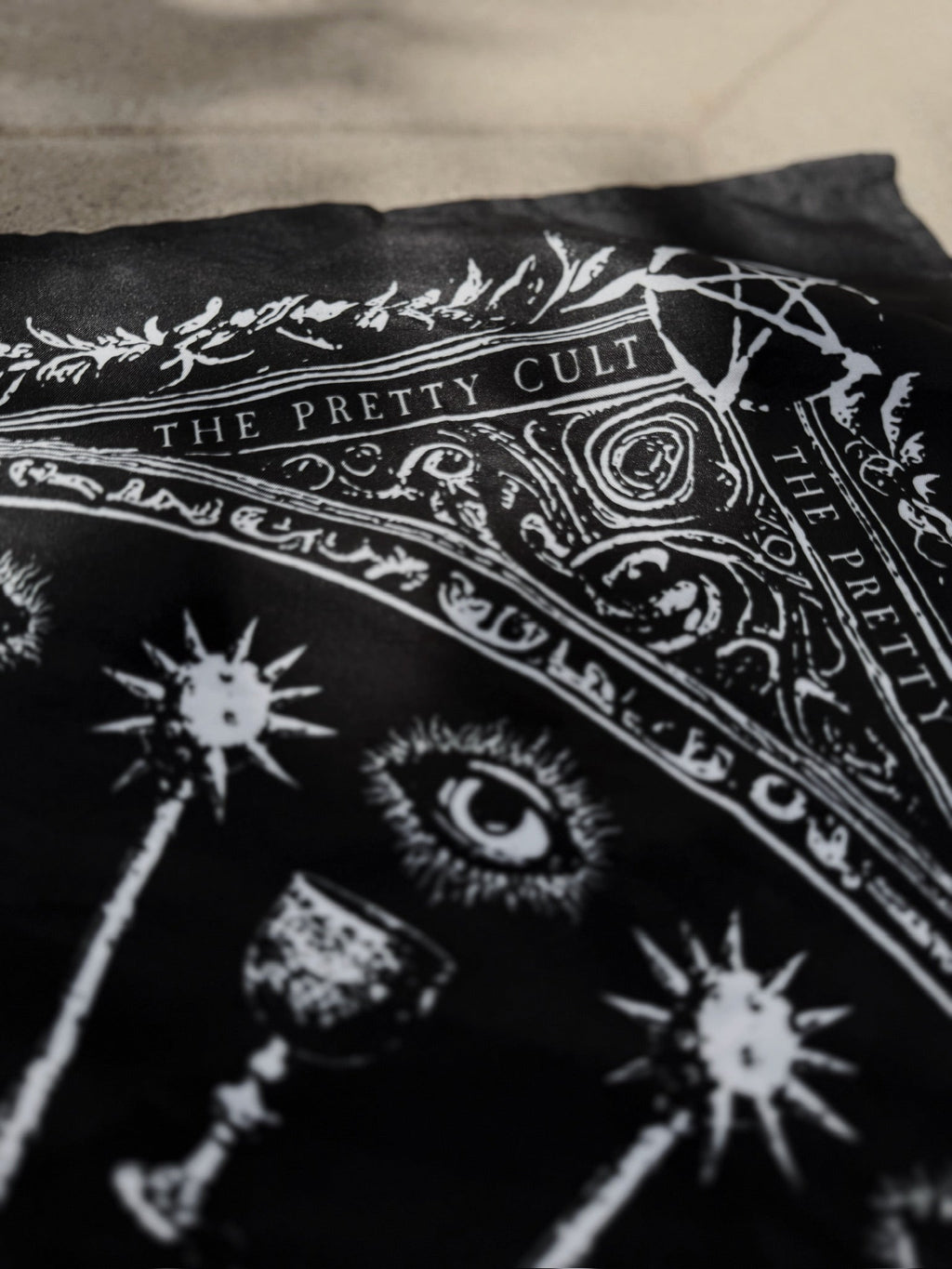 Sigil Print Square Scarf in black with a white occult sigil wheel
