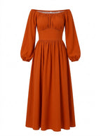 Swann Maxi Dress in Amber Harvest on a mannequin, gathered off-shoulder bodice with long blouson sleeves and a full gathered maxi skirt
