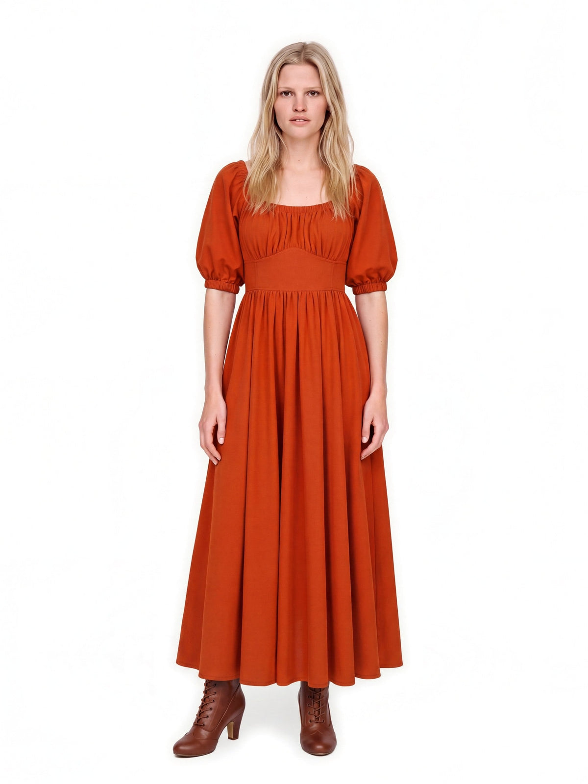 Swann Maxi Dress in Amber Harvest worn with the neckline up on the shoulders, deep spiced orange crepe with puffed elbow-length sleeves and a fitted waistband