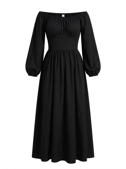 Solid black Swann Maxi Dress on a mannequin, off-shoulder peasant bodice with long blouson sleeves and a floor-length gathered skirt