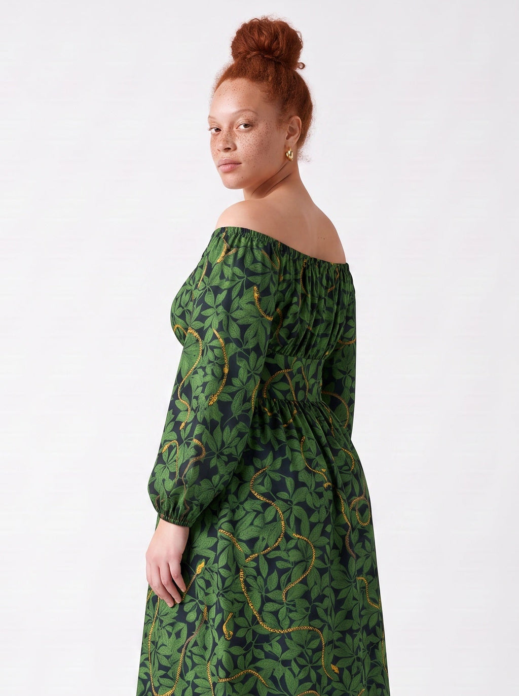 Three quarter view of the Swann Maxi Dress in Black Serpente, off the shoulder with long blouson sleeves gathered into elastic cuffs