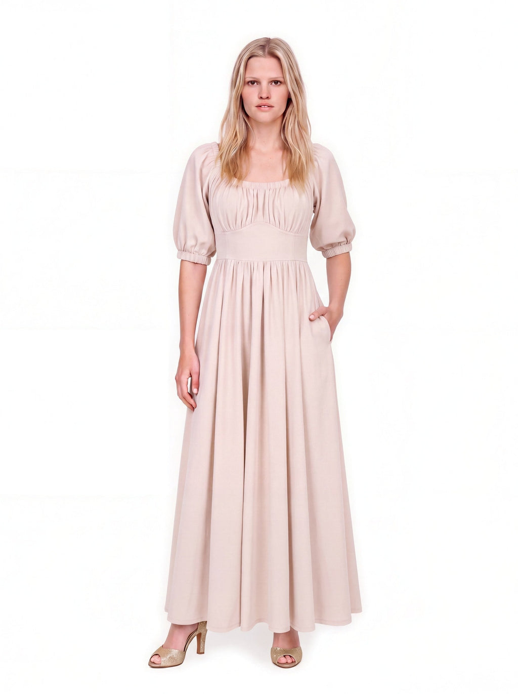 Swann Maxi Dress in Coconut Milk, a warm off-white floor-length maxi with a gathered square neckline worn up on the shoulders, puffed elbow-length sleeves and a fitted waistband