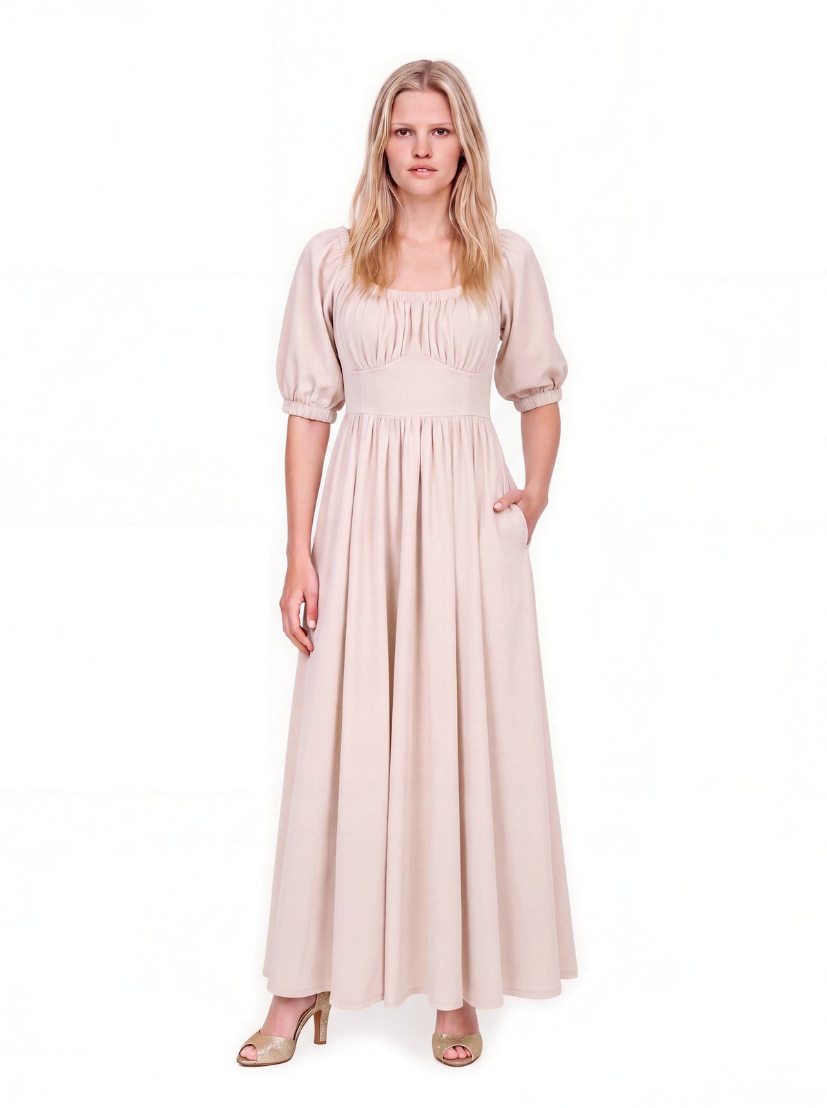 Swann Maxi Dress in Coconut Milk, a warm off-white floor-length maxi with a gathered square neckline worn up on the shoulders, puffed elbow-length sleeves and a fitted waistband