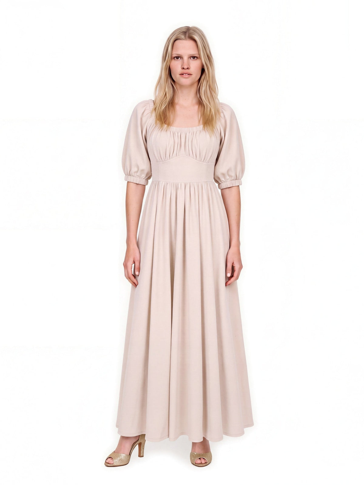 Coconut Milk Swann Maxi Dress with the neckline drawn up on the shoulders, puffed sleeves sitting at the elbow over a full gathered off-white skirt
