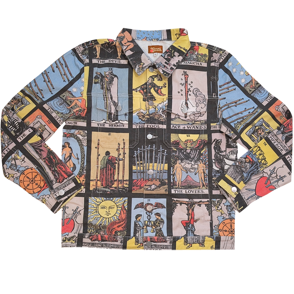 Tarot Card Denim Jacket laid flat, black denim printed with a grid of tarot cards including The Fool, The Lovers and The Sun
