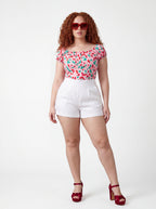 The vintage cherries peasant top in pink, made to order by Pinup Girl Clothing, sizes XS to 5X.