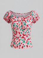 The vintage cherries peasant top in pink by Pinup Girl Clothing, sizes XS to 5X.