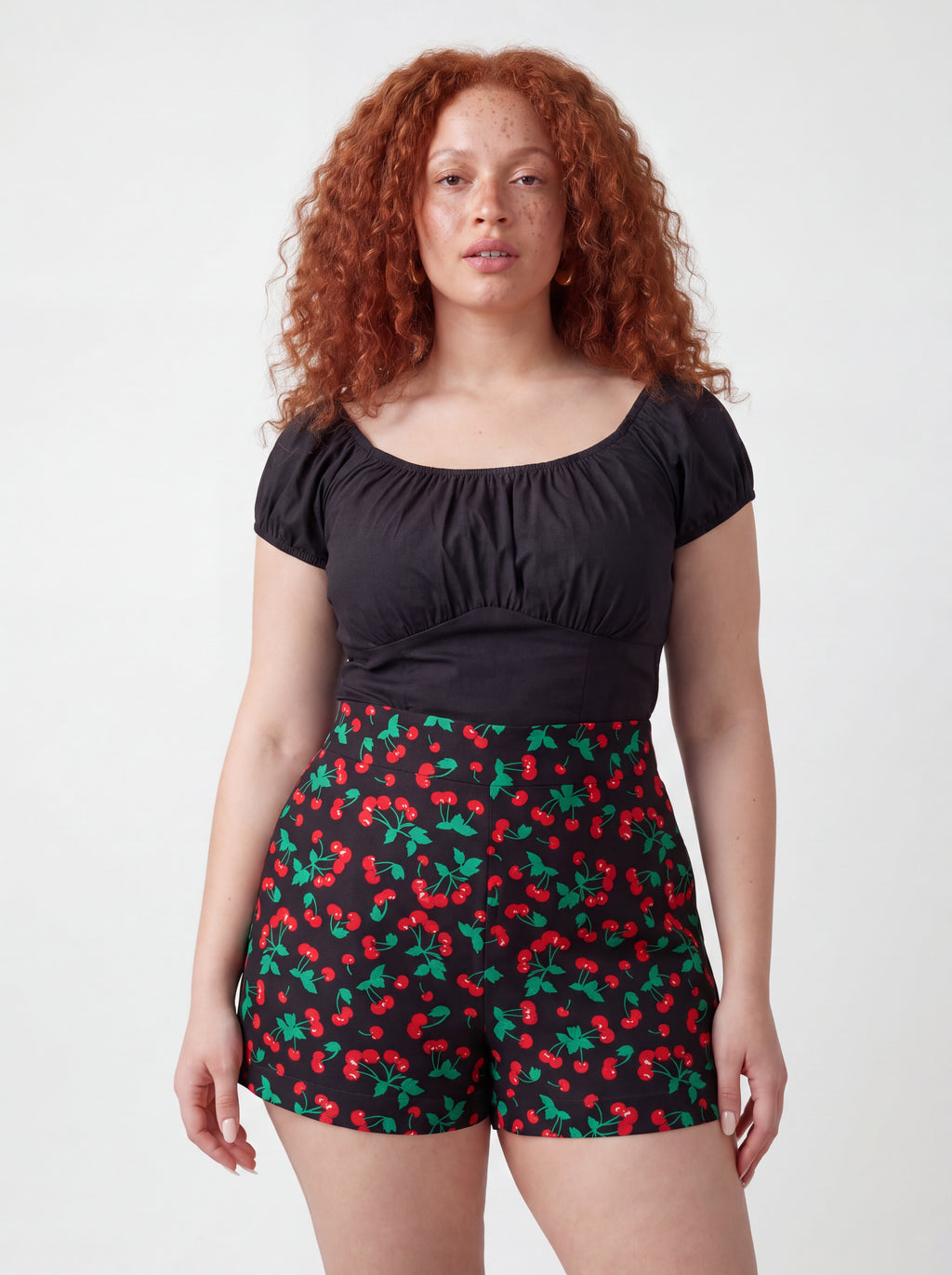 Vintage cherries LB high-waisted shorts in black by Pinup Girl Clothing, sizes XS to 5X.