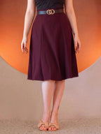Viva 40s Tulip Skirt in Burgundy from the waist down, high waist with a gold ring belt, paneled skirt flaring to just below the knee, worn with tan bow sandals