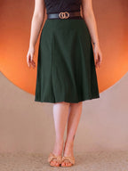 Viva 40s Tulip Skirt in Hunter Green from the waist down, high waist with a gold ring belt, paneled skirt flaring to just below the knee, worn with tan bow sandals