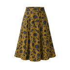 Viva 40s tulip swing skirt in ochre Capri Floral print, black blooms on gold stretch crepe, high waistband and flared skirt to the knee