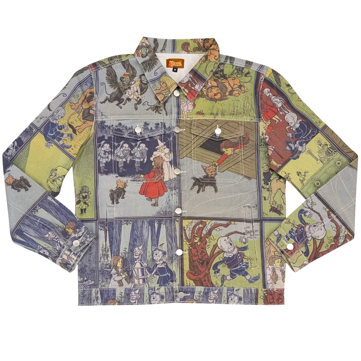Wizard of Oz Denim Jacket laid flat, denim printed with vintage Wizard of Oz storybook panels in blue, green and cream